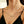 Trendy Y2K style personalized gold Old English name necklace as a cool and thoughtful gift for women