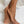 Custom gold multiple name anklet featuring cursive script names Emma and Noah on a delicate chain